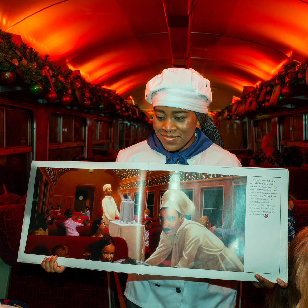 Chef holding book on board The Polar Express