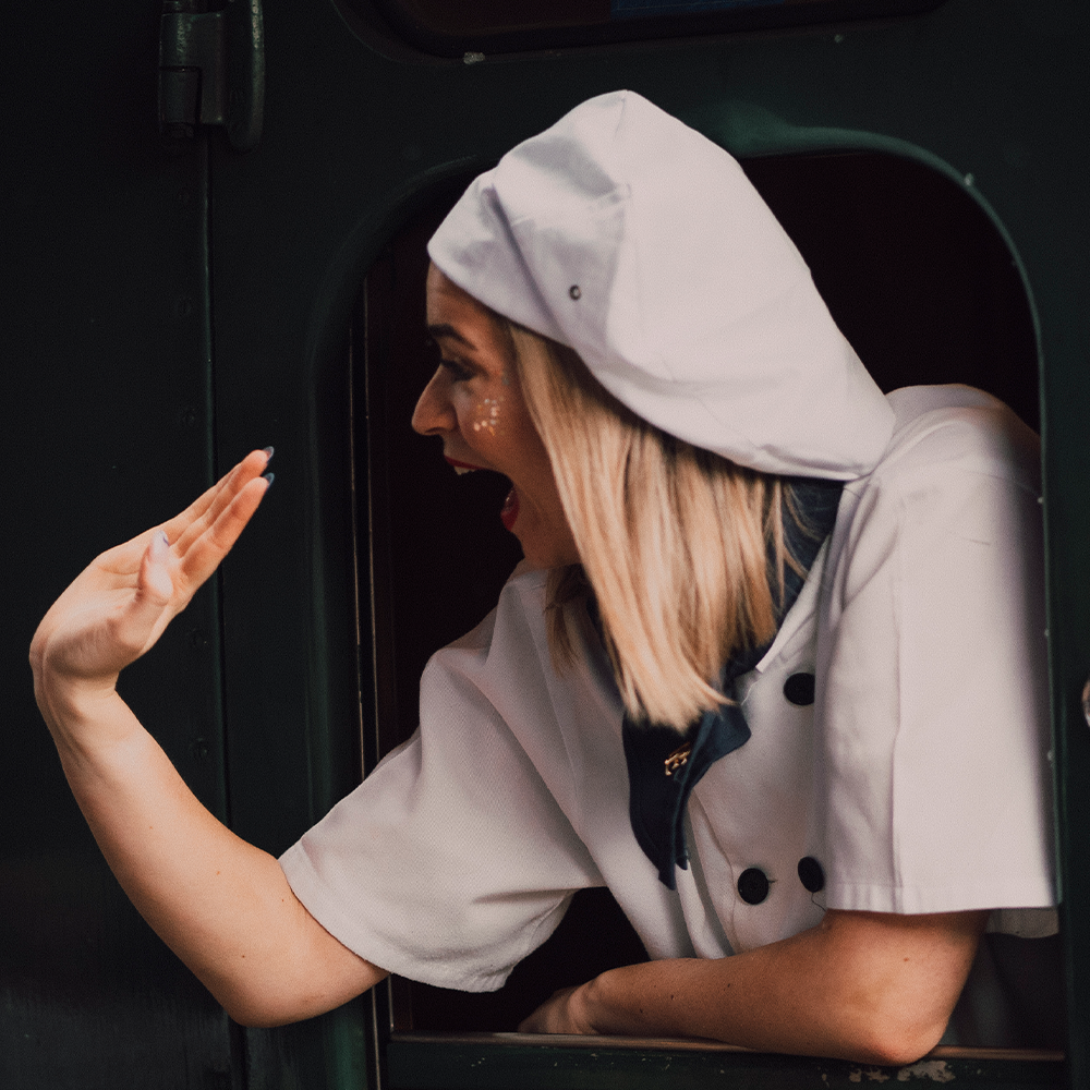 Chef waving on board The Polar Express Train Ride
