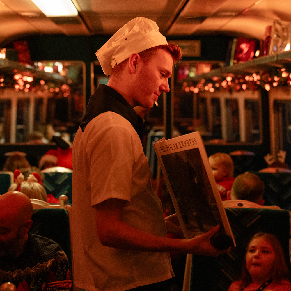 Chef waving on board The Polar Express Train Ride